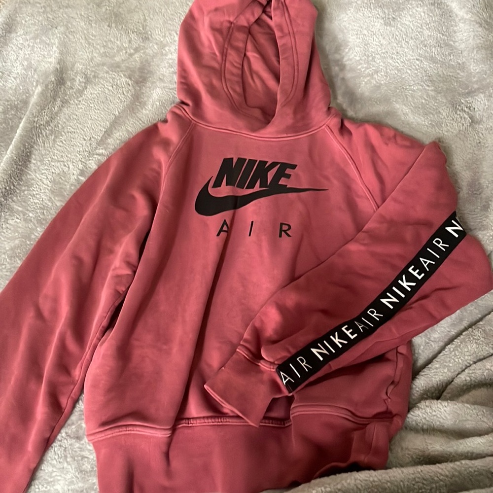 Maroon Nike air sweater. Nike air writing along the arms and back.